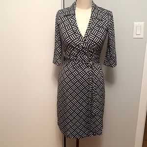 Femme brand wrap dress navy and white geo print with 3/4 sleeve. Size S